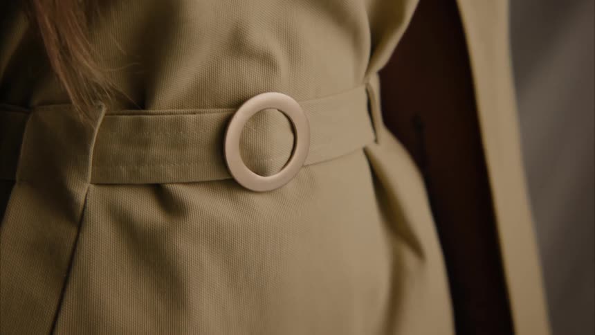 A model tightens her belt
