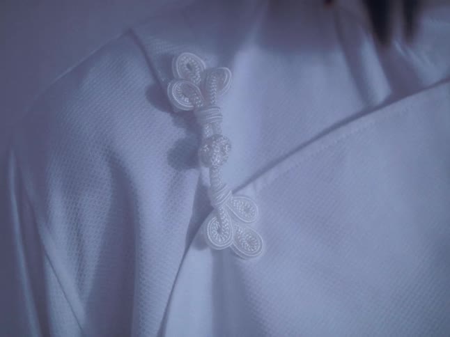 A male model wearing white clothing