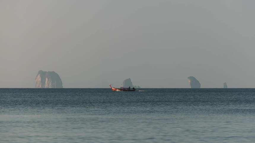 People on a small boat traveling in water