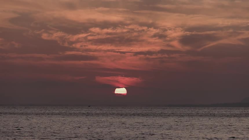 Ocean water flows as the sunsets