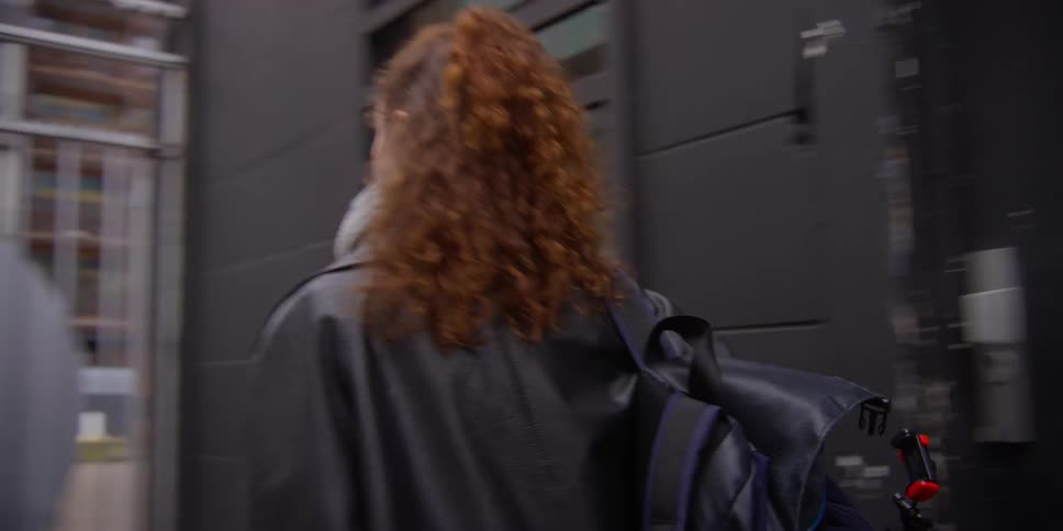 A woman leaves the building