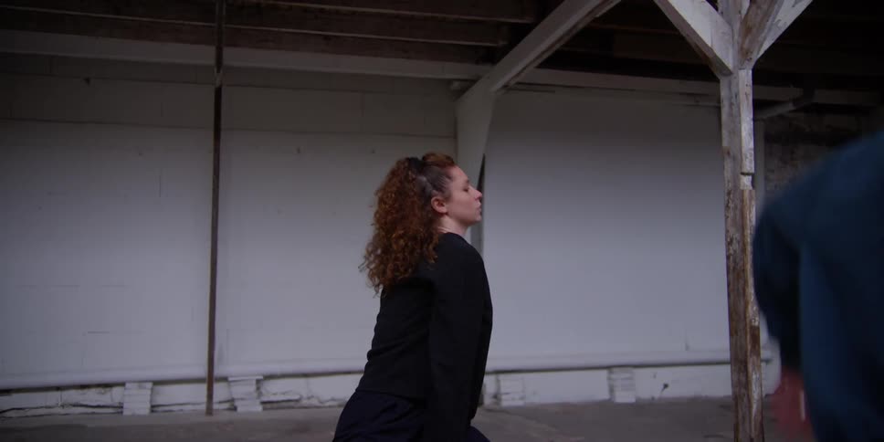 Two women are swinging their arms