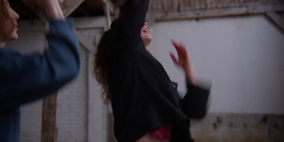 Female dancer shows woman how to dance