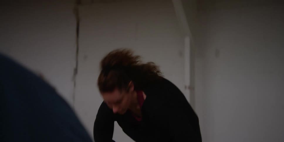 A young woman warming up to do dance moves