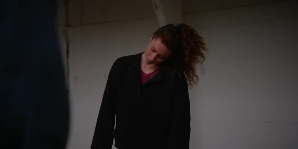 A woman stretches her neck