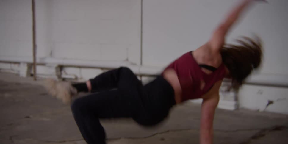 A woman is swinging and flipping around
