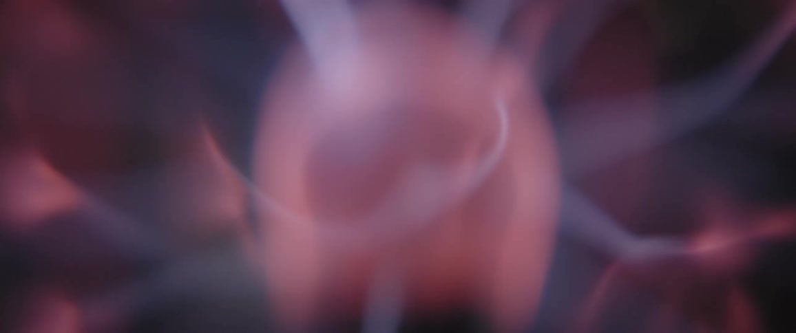 Strands of electrical energy emerge from a pink rotating orb