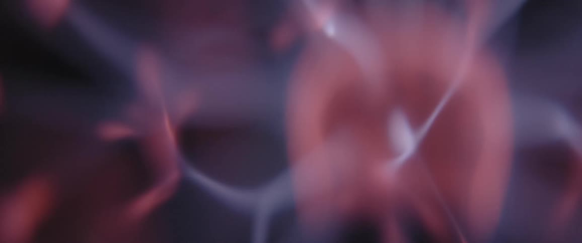 Wisps of glowing electrical energy emerge from a pink rotating orb