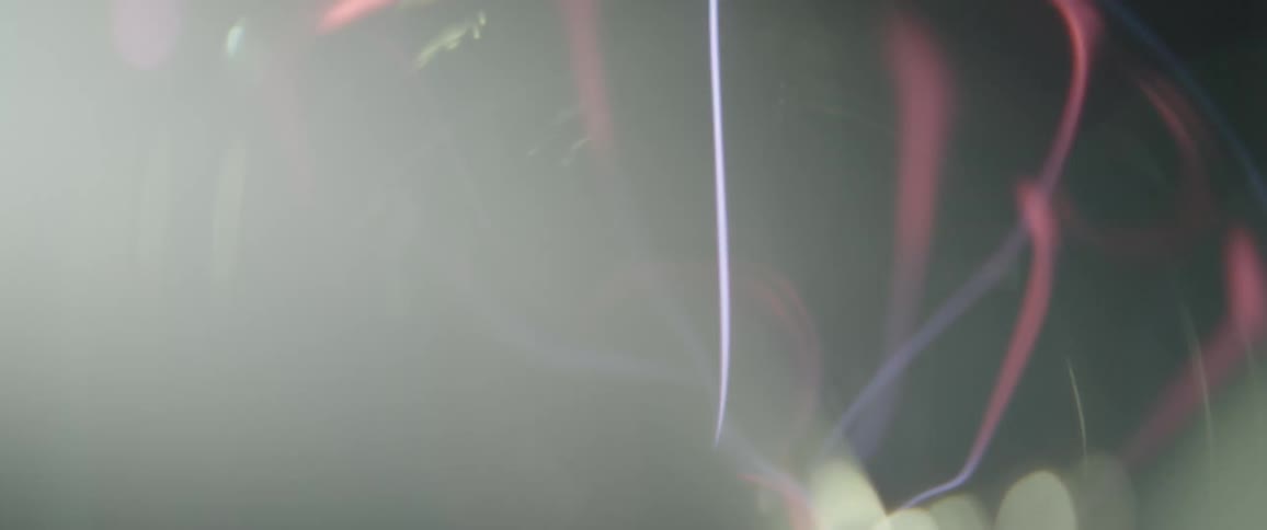 A close up of a plasma ball with the electric arcs and the glowing gas inside