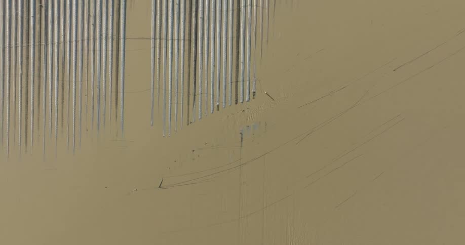 A wornout wall with vertical and diagonal streaks