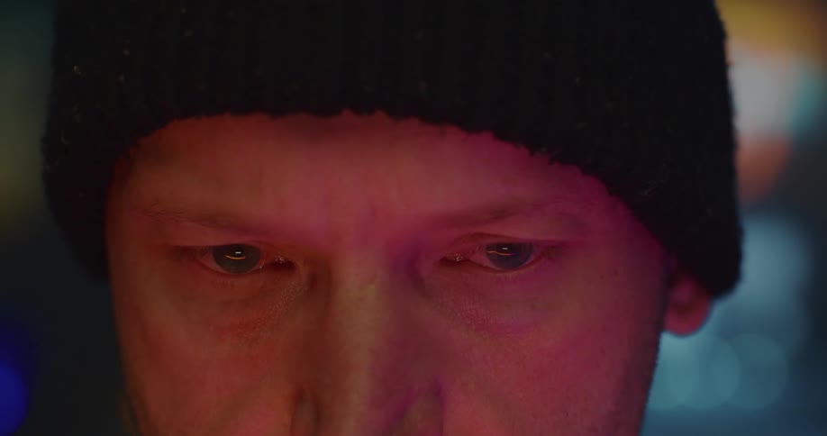 A mans eyes follow an object until he looks up