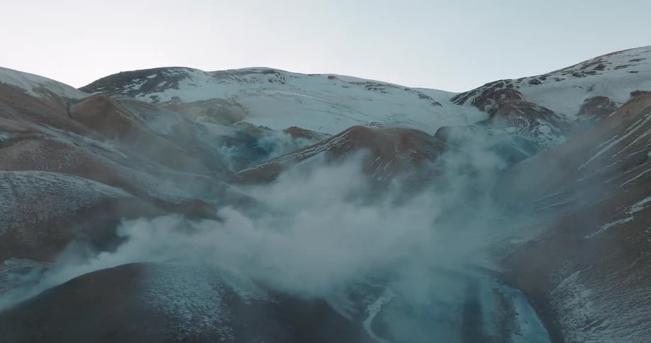 Smokes coming out of mountains during the day