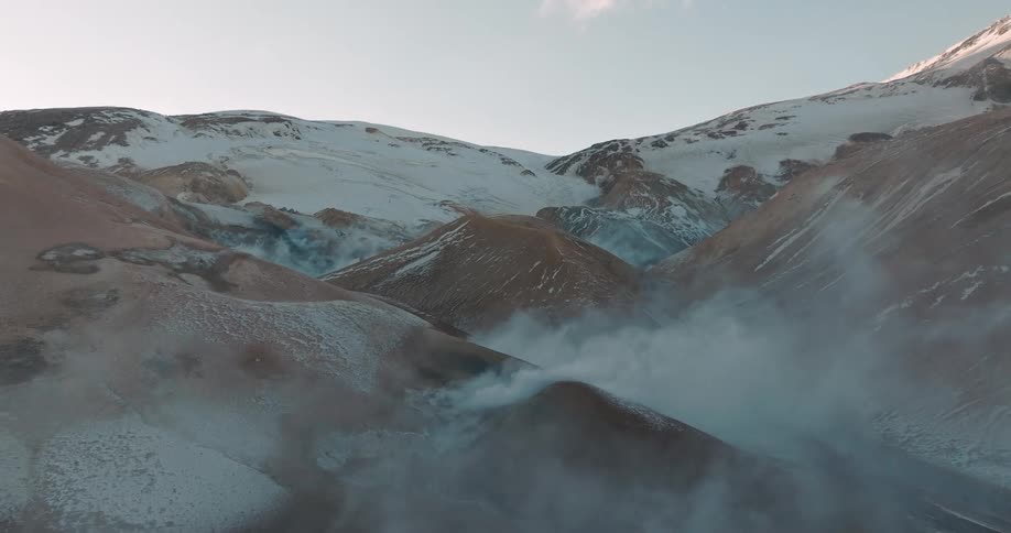 Smokes at mountain tops during the day
