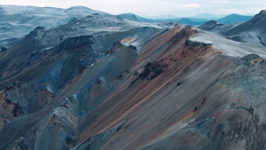 Aerial of brown rocky mountain range during daytime