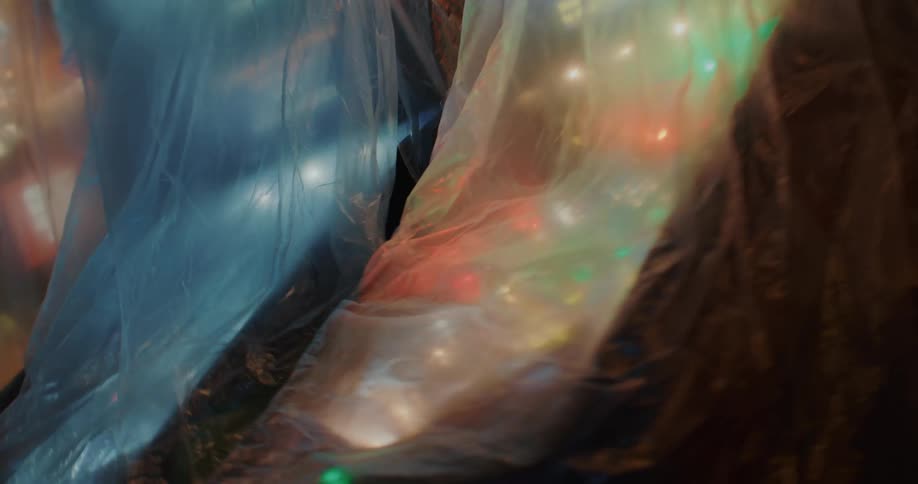 Arcade machines plugged in and covered in plastic