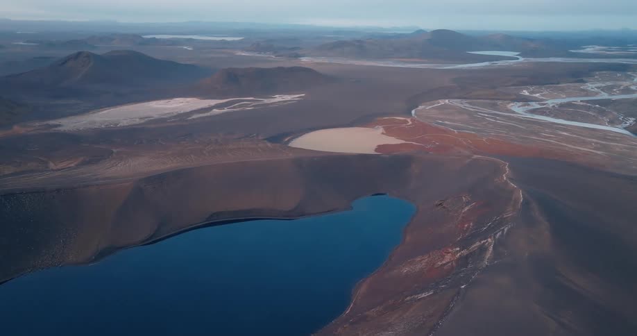 Aerial view of a crater lake on a mountainous landscape
