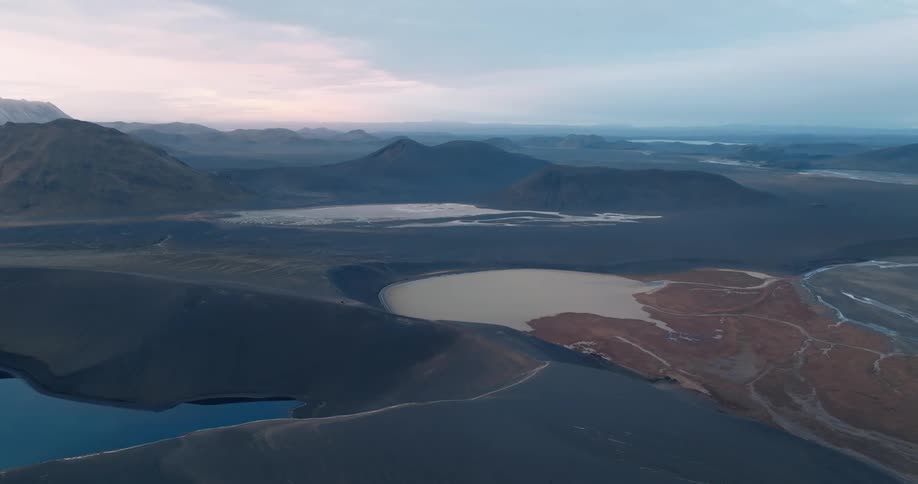Volcanic mountains and lakes forming in old craters in Iceland