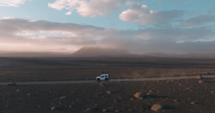 Vehicle drives along highway through flat terrain on a foggy day