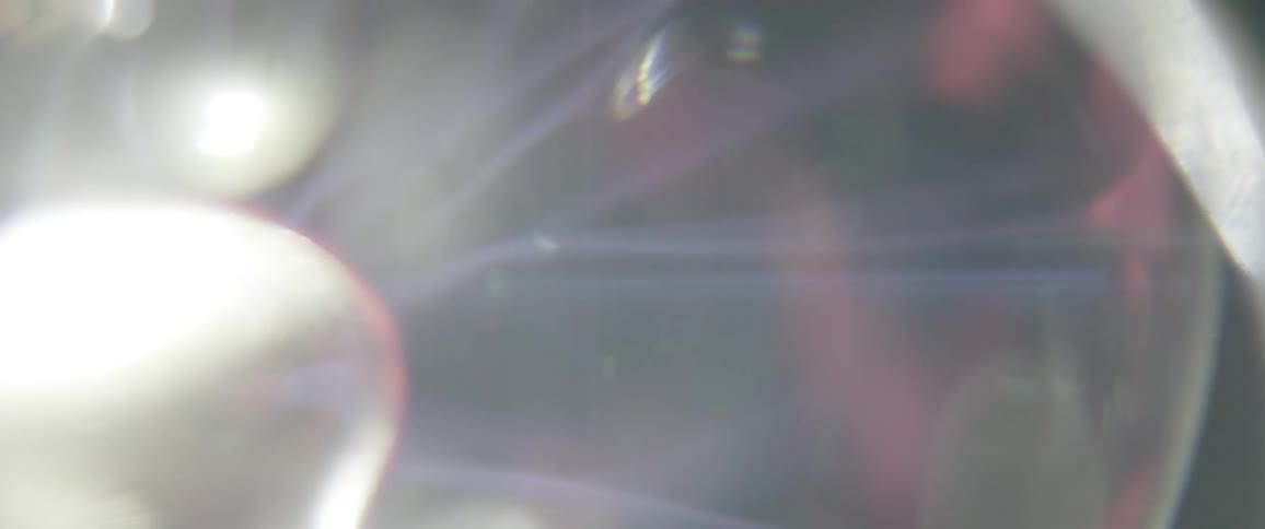 Close up of a plasma ball with colorful electric discharges