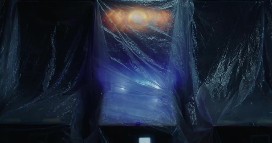Close up of a pinball or arcade machine light up under a clear plastic cover
