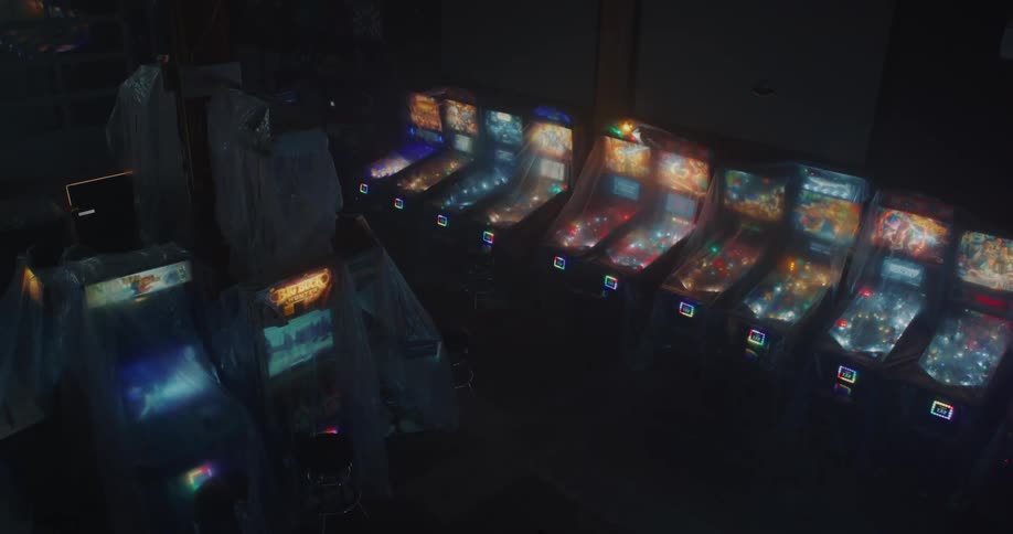 A dark room full of old but working arcade machines