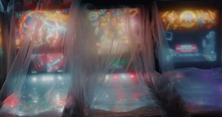 Colorful pinball machines under clear plastic covers