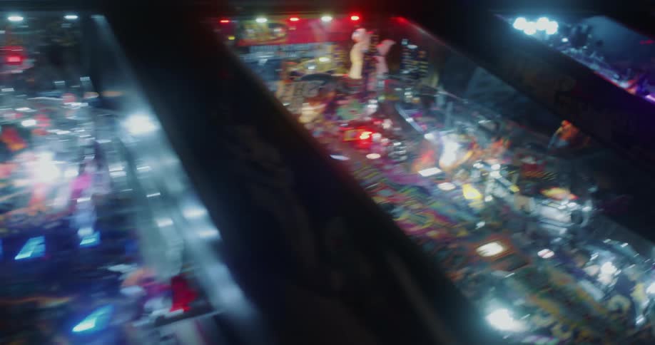 Arcade machines glowing with neon lights at night