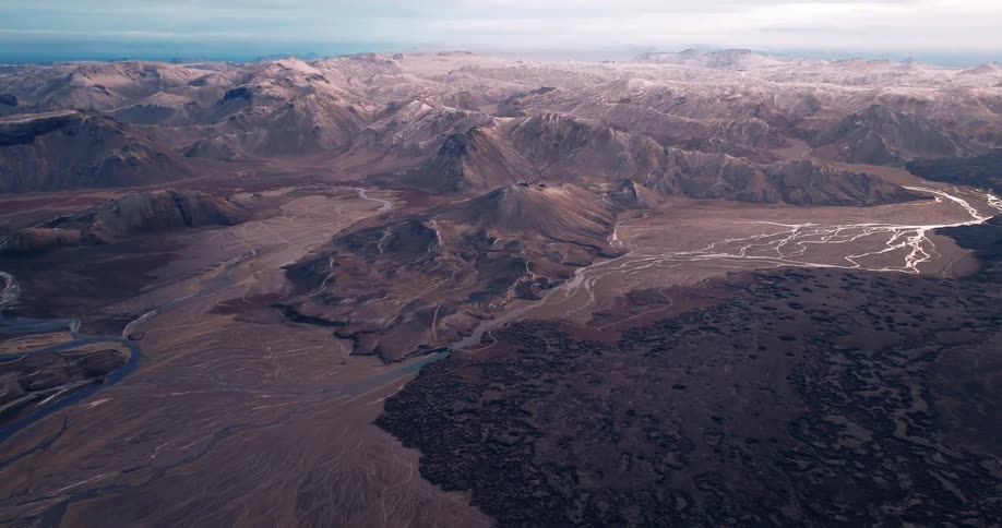 Aerial panorama of mountain ranges on geological soils