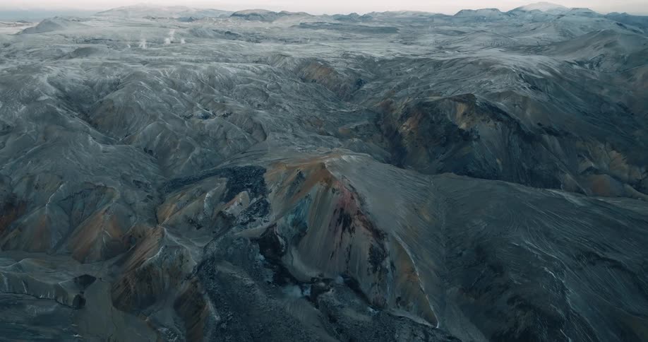 Aerial of a rocky mountain range during a cloudy day