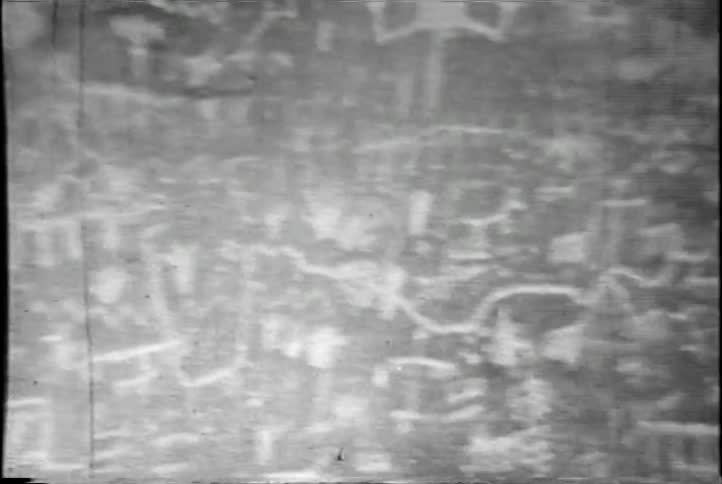 Ancient sketches appear on a wall