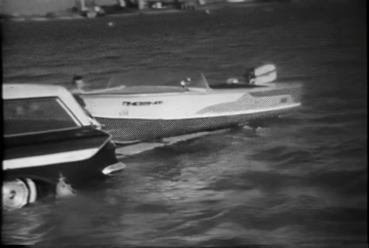 A car bakes a boat into the water