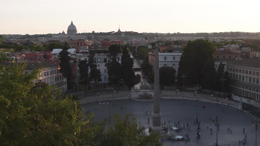 Panorama of an urban city overlooking a central square with pilar and people walking