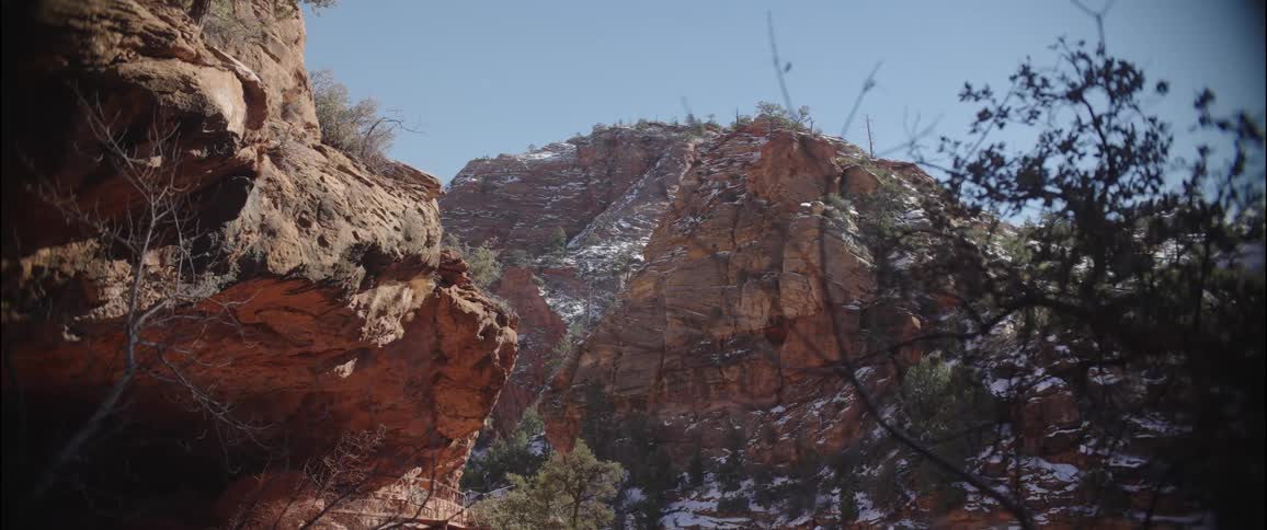 Landscape of ruins and canyons with a little snow on a cloudless blue sky day