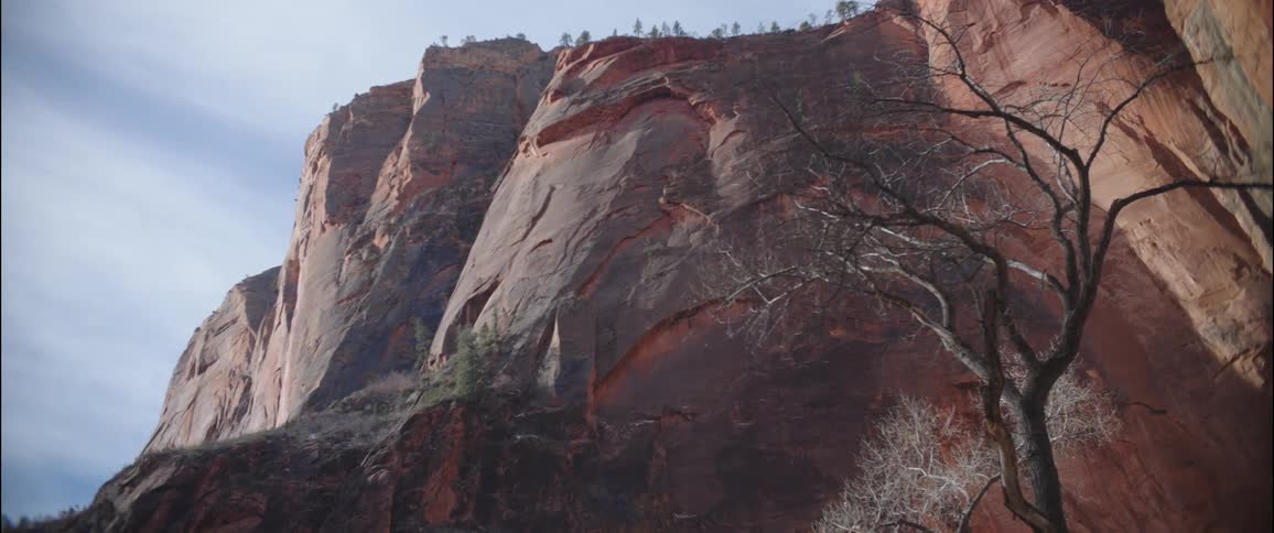 An orange rocky canyon during the day