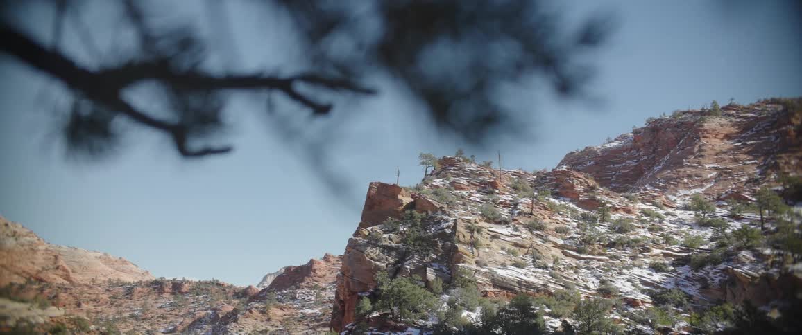 Ruins in canyons with snow on a cloudless blue sky day