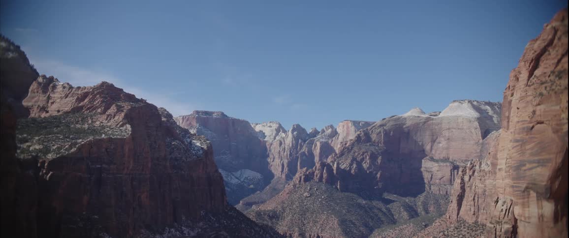Aerial of a canyon park with snow melting during the day