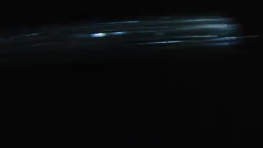 A streak of light moves rapidly