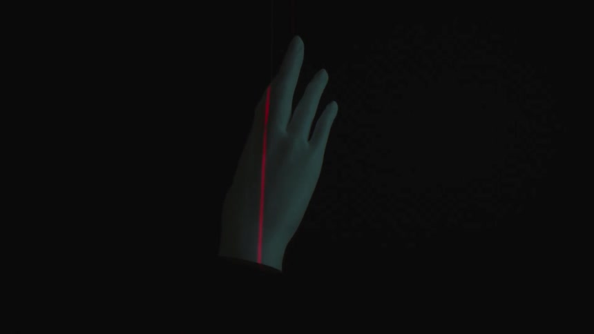 Abstract plaster hand rotating with a red led