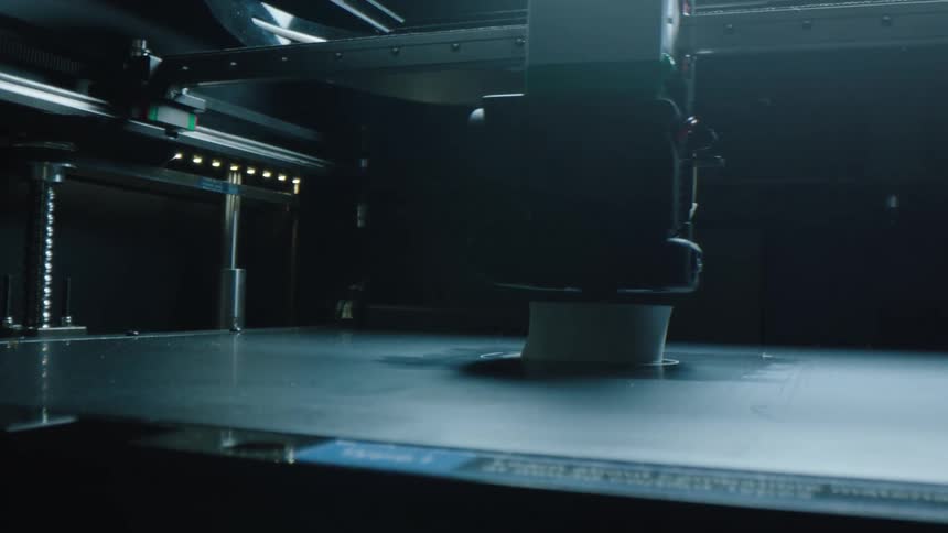 A robotic arm polishes a substance