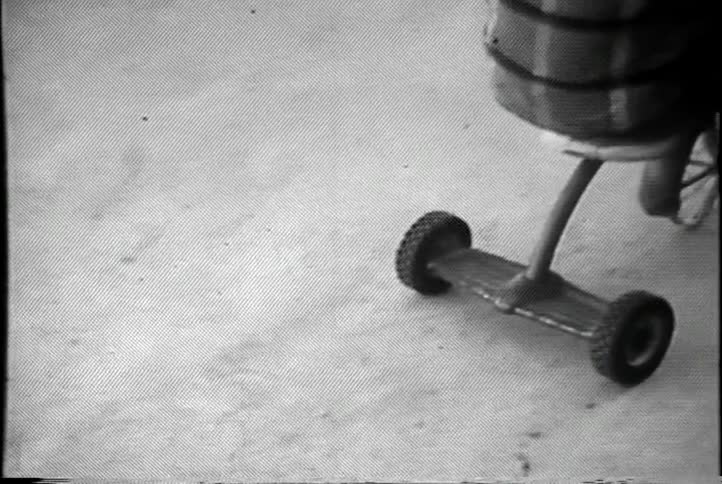 A child rides an old-fashioned tricycle