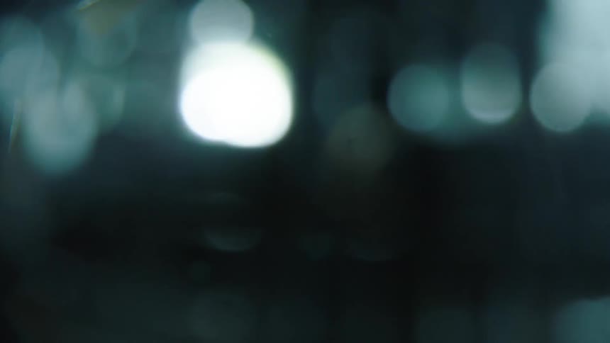 Some blurred lights in a dark environment