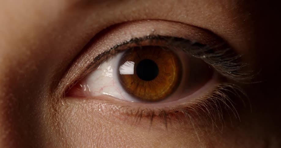 A person opens their eyelid