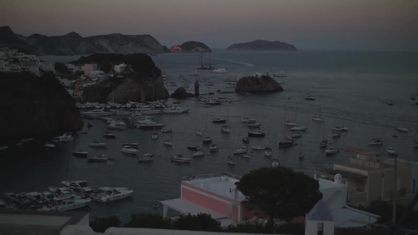 A small bay on the coast filled with various boats