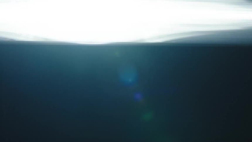 A fast light passing quickly on a black background