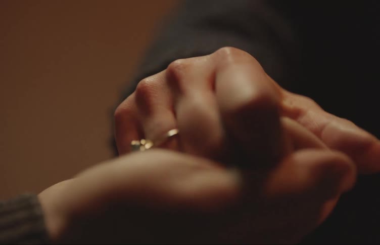 Close up of man and woman holding hands