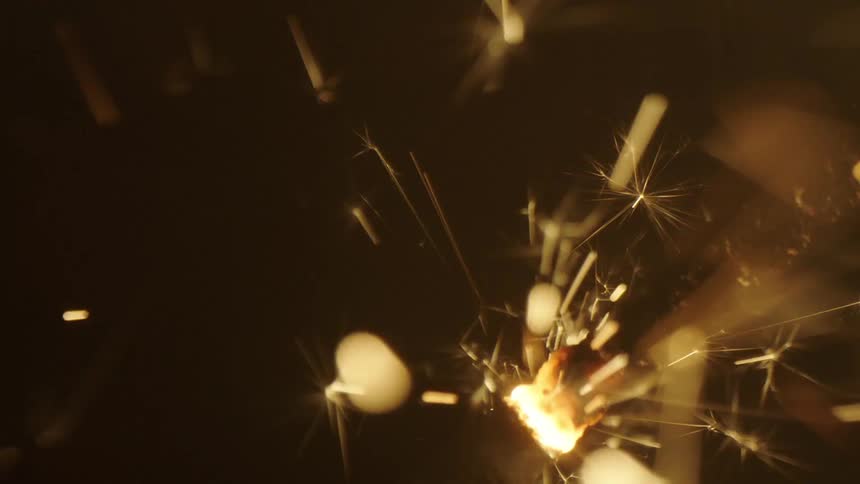 Extreme close up of a burning birthday candle