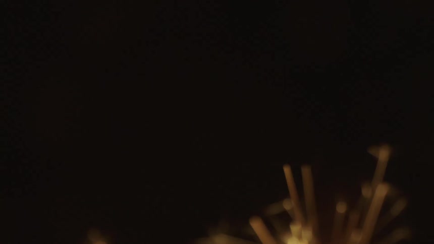 Extreme close up on candle sparks