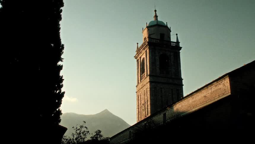 A bell tower in a castle during sunrise