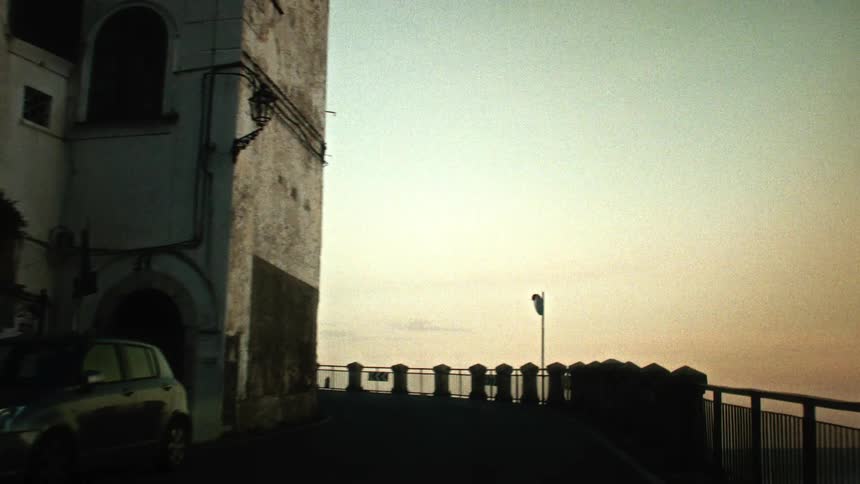 A winding road is by the cliff