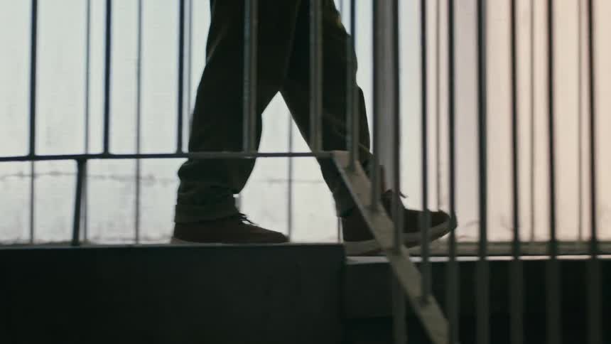 A person going down a buildings stairwell